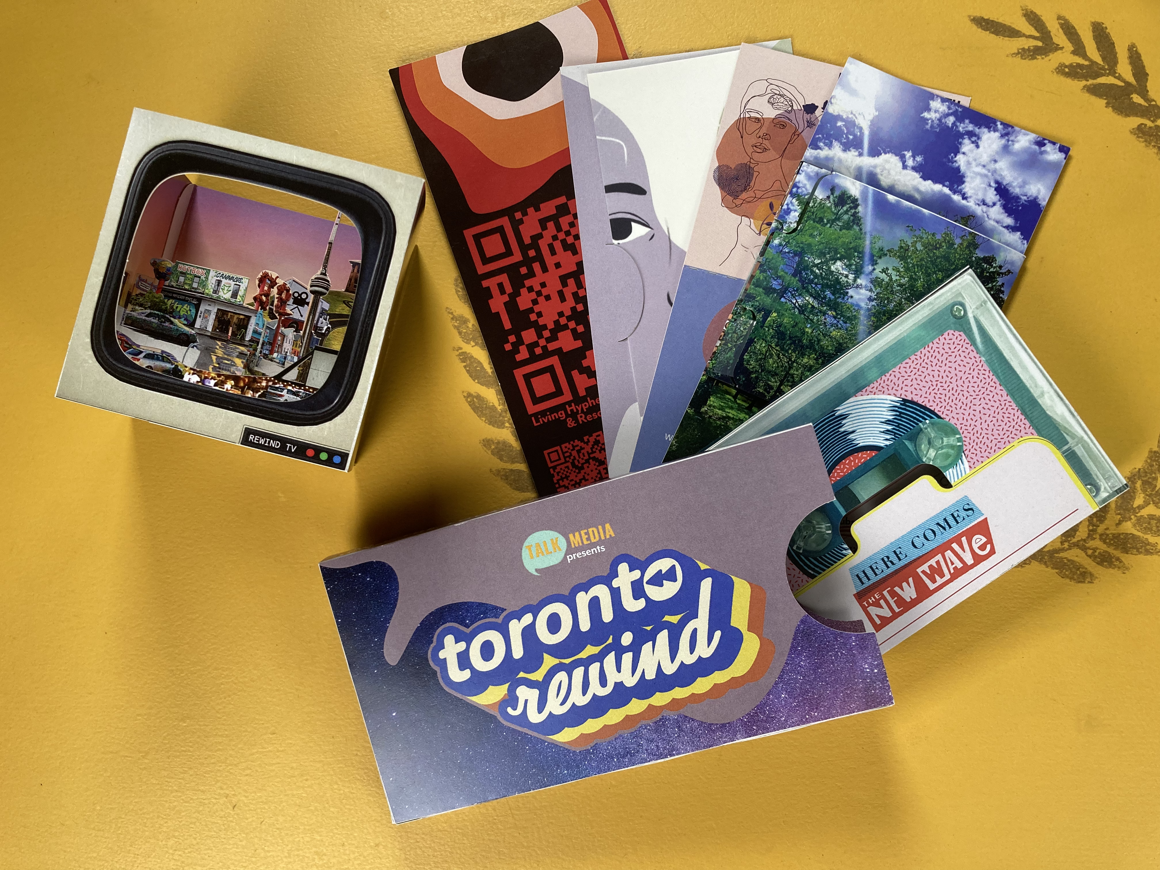 The final design and all of its pieces. The highlight is the TV cube with the layers making a scene of Toronto including elements from the stories to be told.
